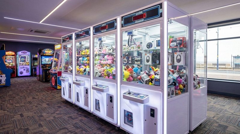 Crane and claw machines on an arcade floor in a UK family entertainment centre