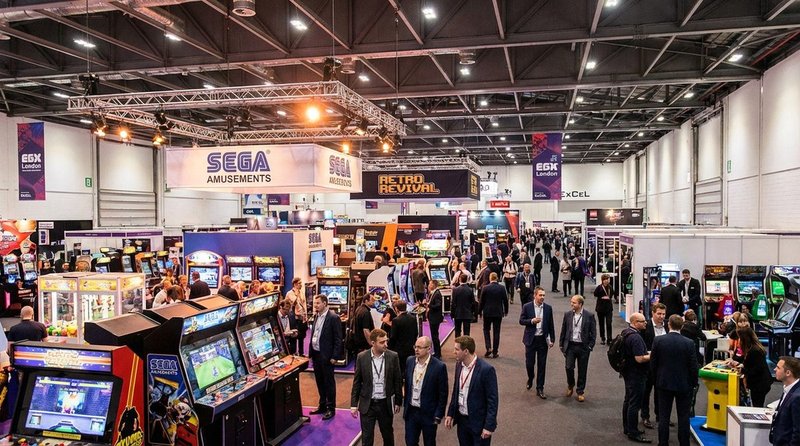 EAG Expo exhibition floor at ExCeL London with arcade machines and trade visitors